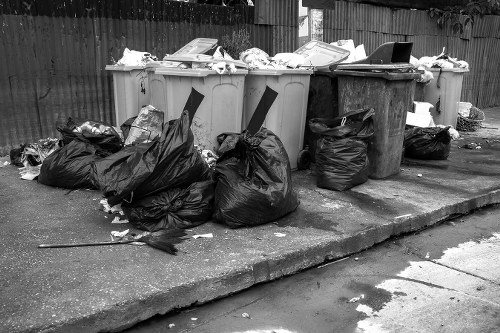 Construction site with waste clearance in progress in Hounslow